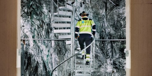 Statkraft employee walking up stairs in hydropower plant